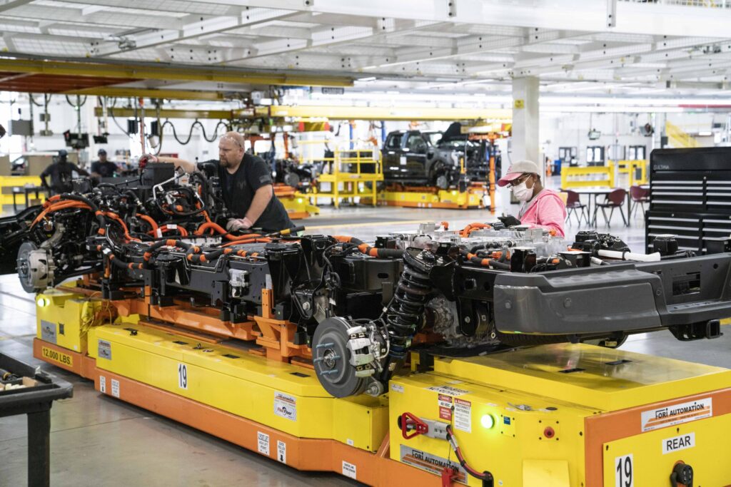 Ford F-150 Lightning underbodies at Fords Rouge Electric Vehicle Center are inspected in Dearborn, Michigan. (Sarah Rice/Getty Images)
