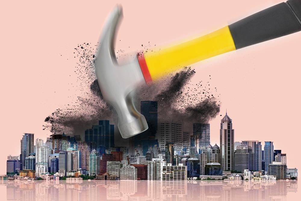 Image of a hammer smashing a city (TAP)