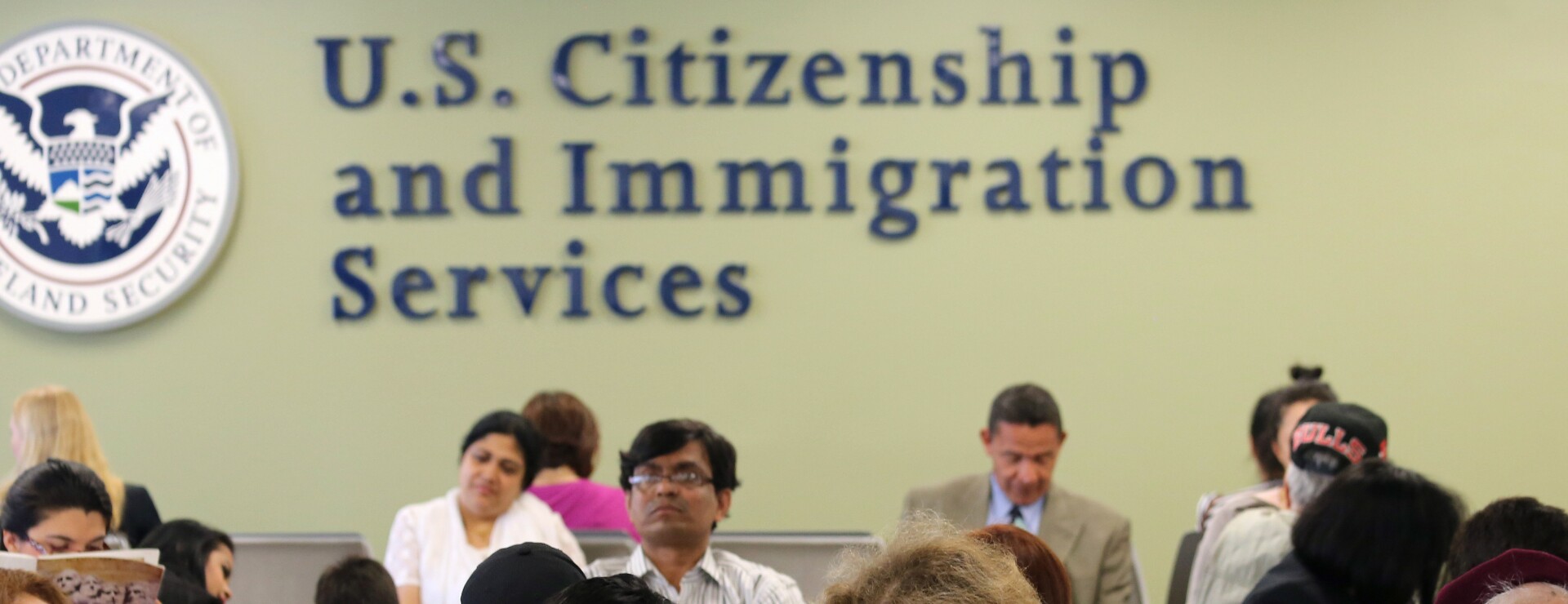 US Citizenship and Immigration Services has been asked to extend the work eligibility period for people with pending renewals on their permits to work in the states. Photographer: John Moore/Getty Images