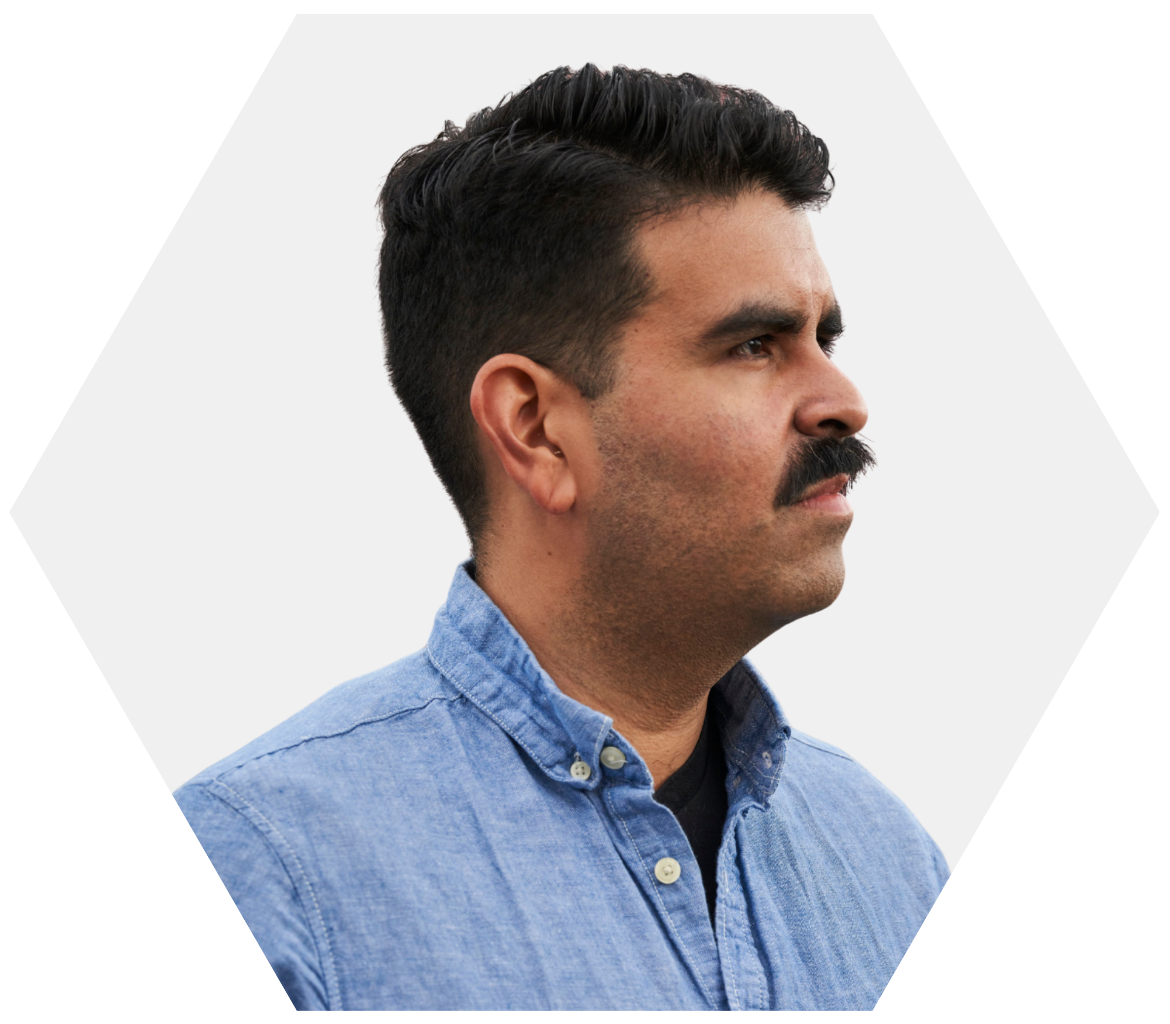 A headshot of a man with a mustache