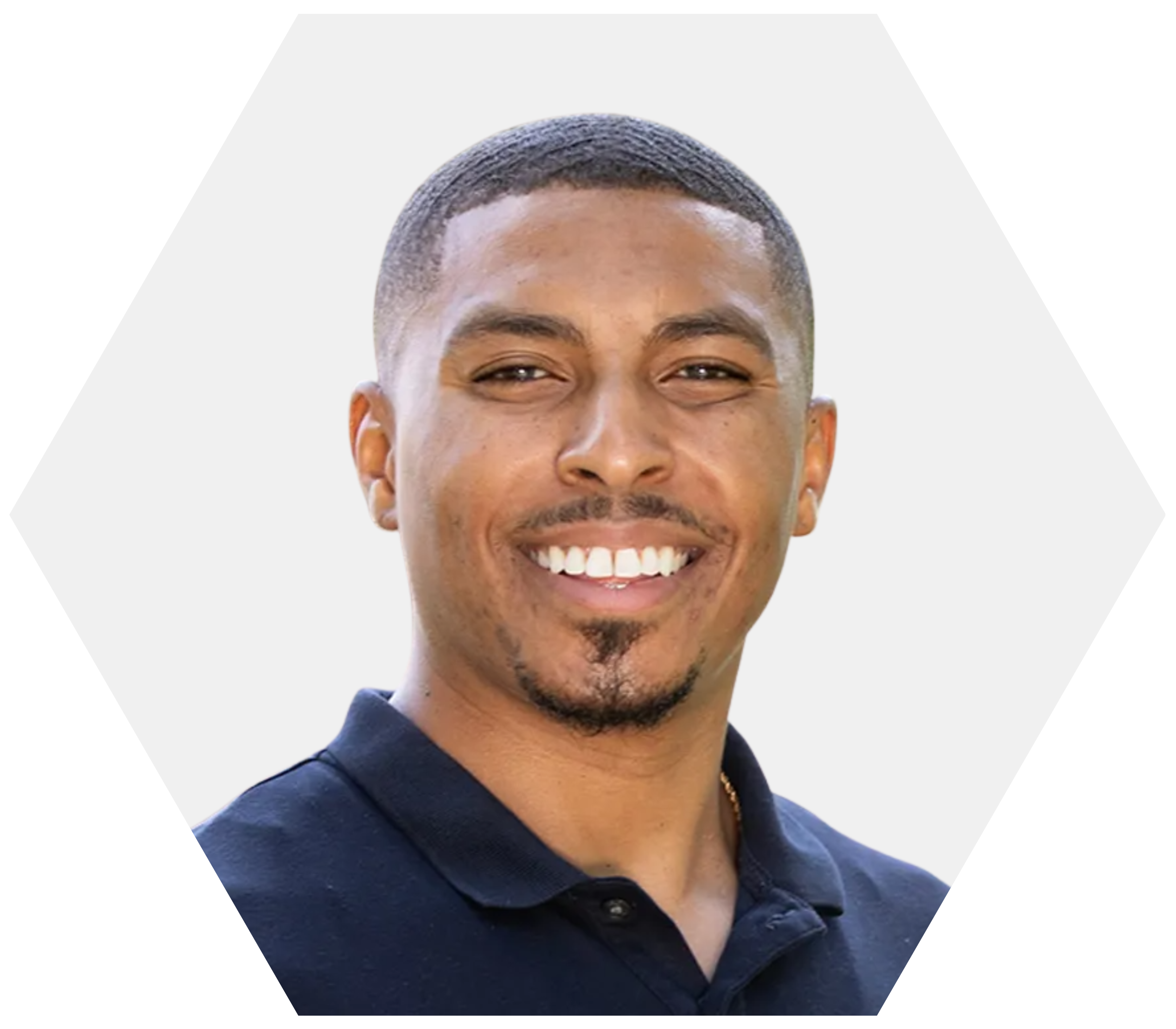 A headshot of a man smiling