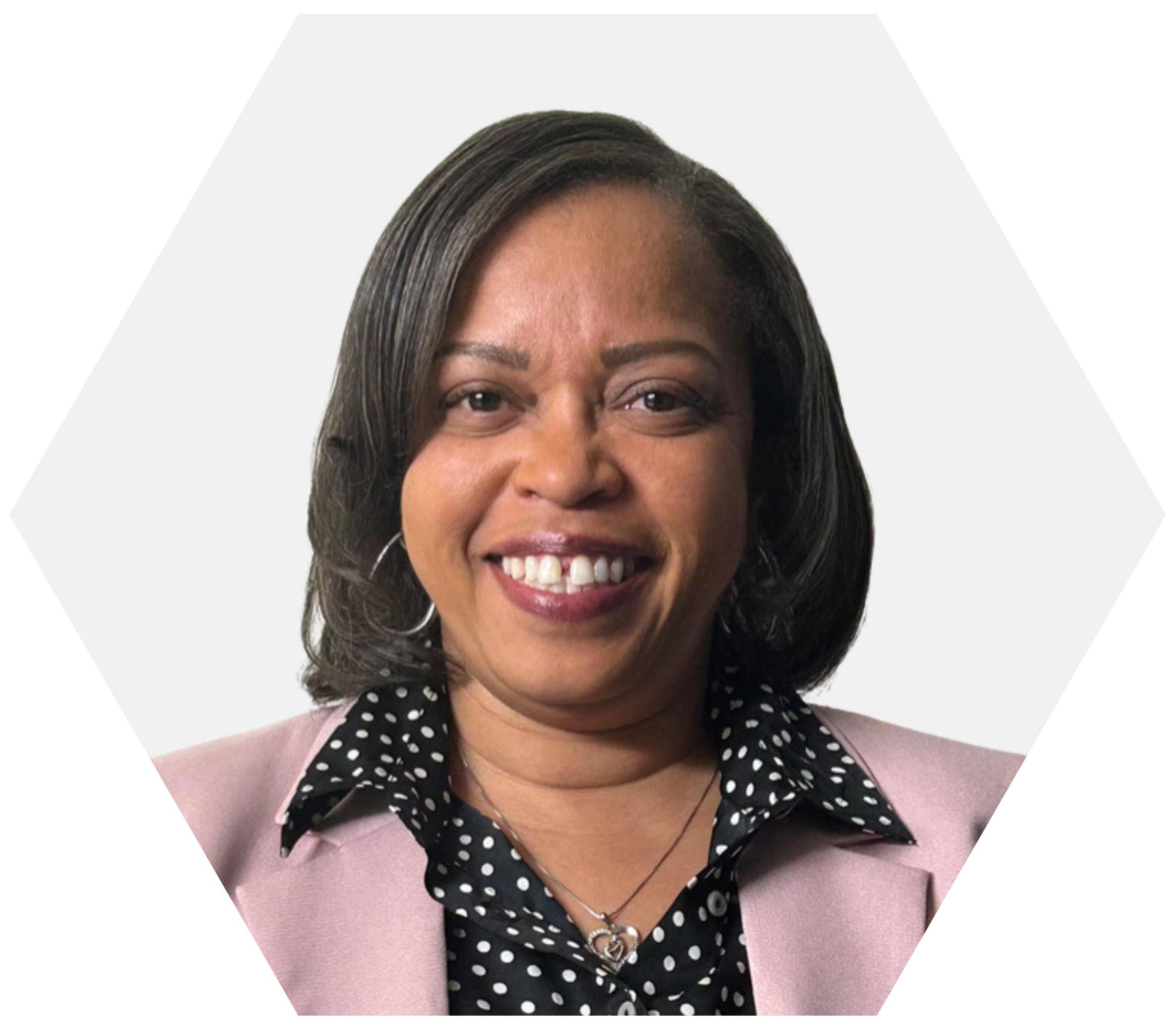 A headshot of a smiling woman