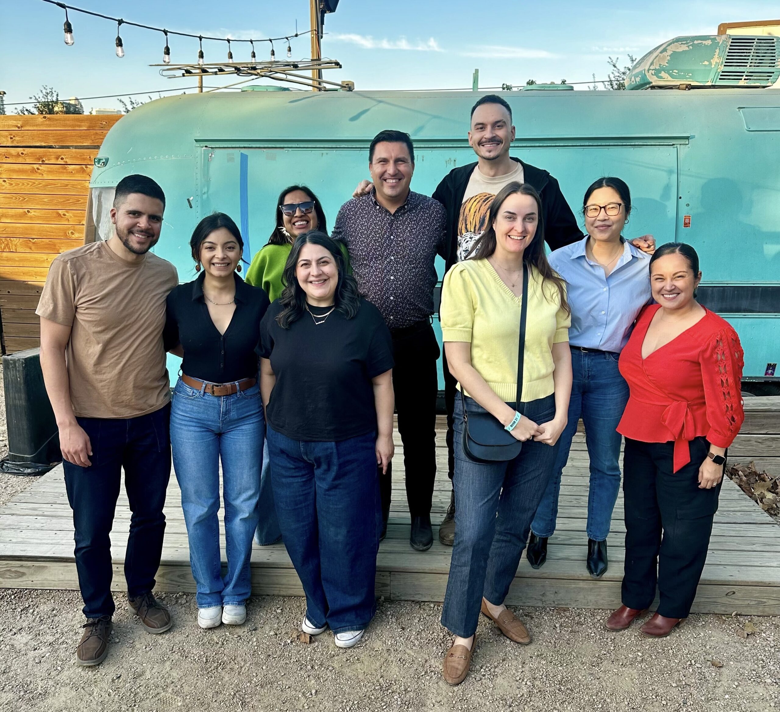 A group of LPTX members and partners gather for a group photo outside at a meet-up!