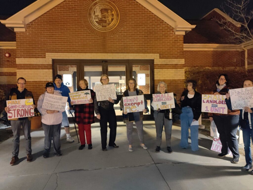 A group of tenants holding signs in fishkill NY