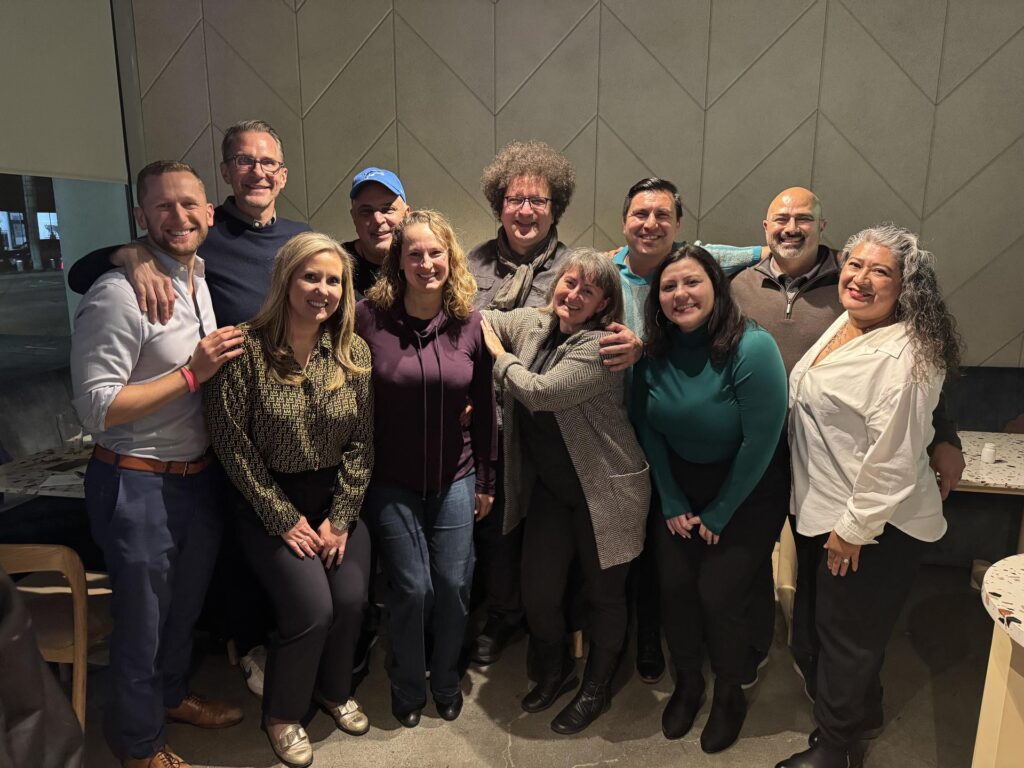 A group of people smiling for a photo