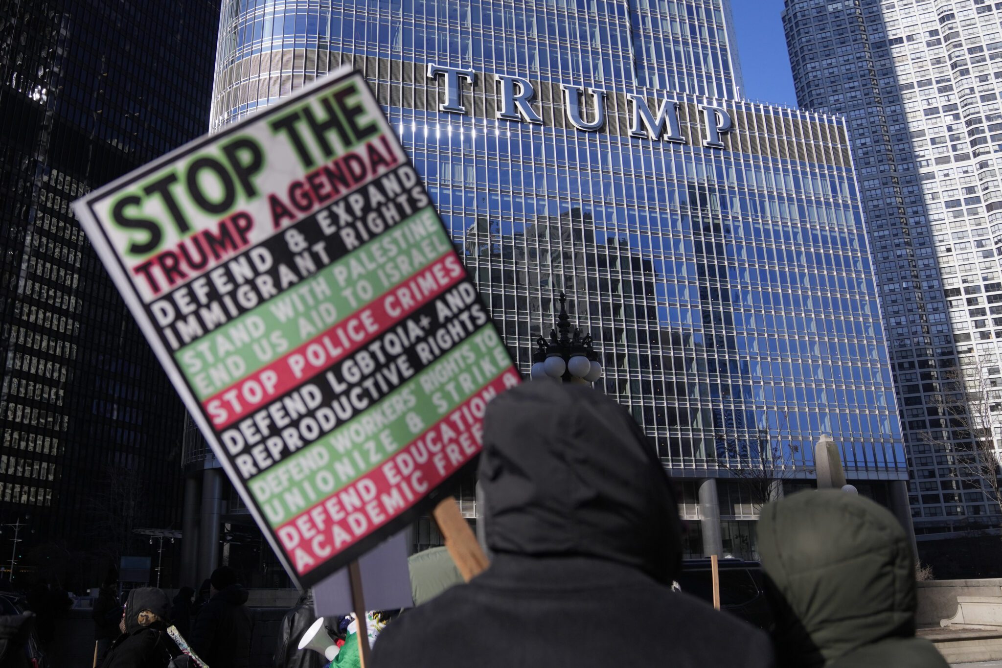 Anti-Trump protesters rally on Monday, Jan. 20, 2025, in Chicago. (AP Photo/Erin Hooley)