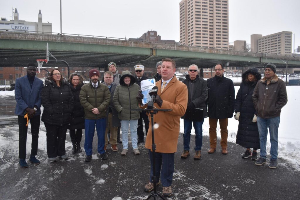 A group of people standing outside in the snow