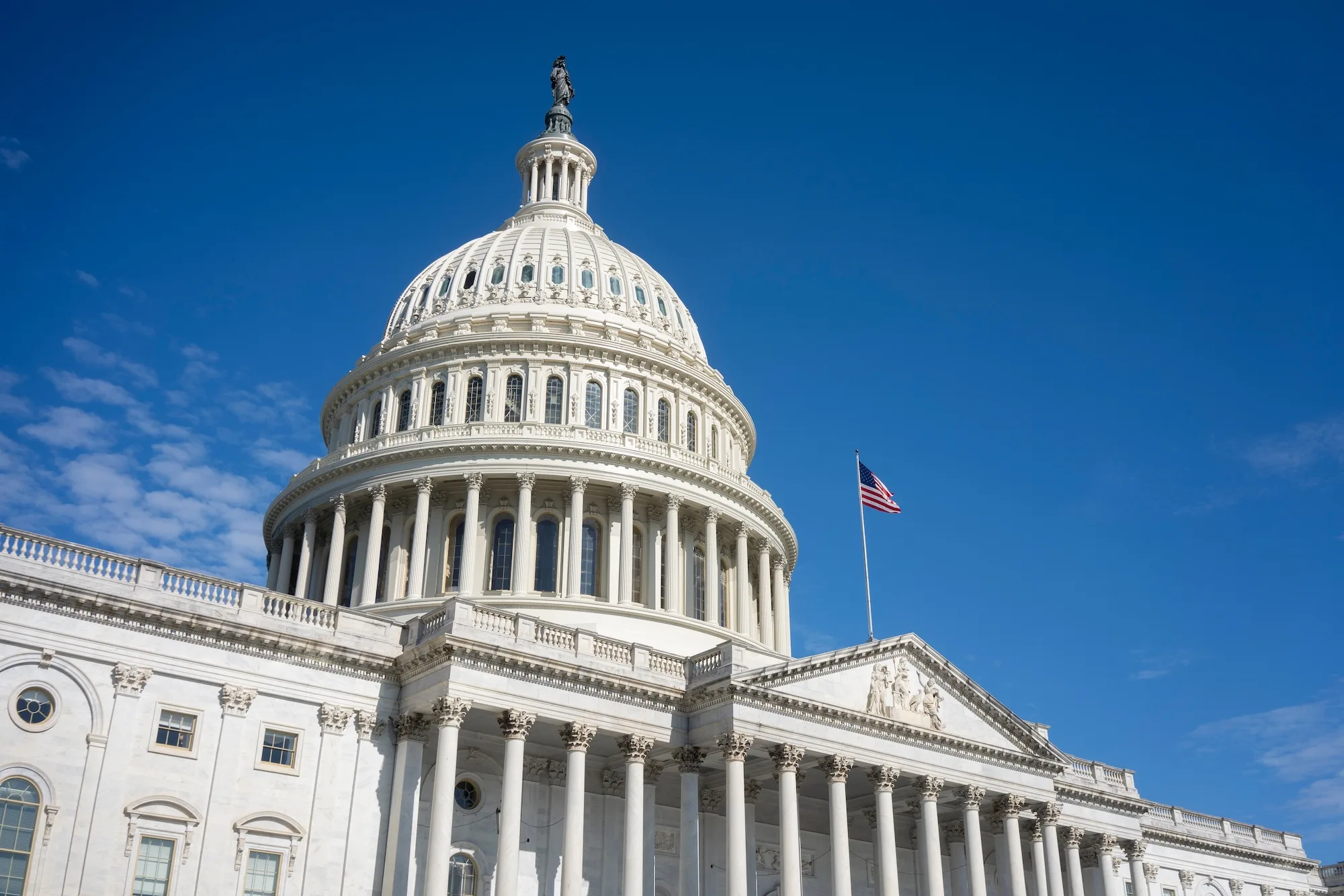 East Front of the United States Capitol in Washington, DC, against blue sky and clouds. Photo: Tada Images via Shutterstock