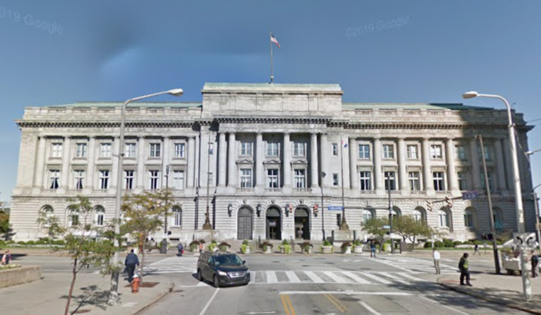 Image of a government building set against a blue sky