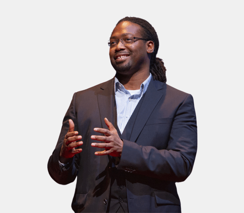 A professional headshot of man talking