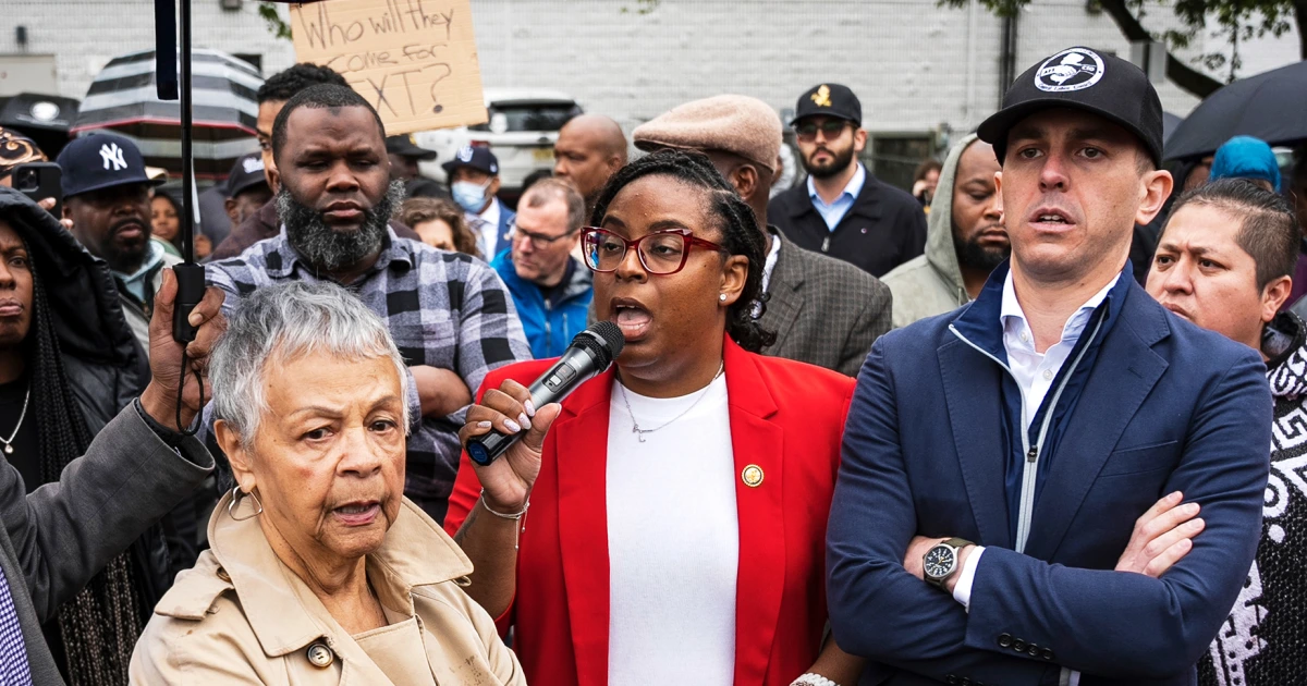 Image of a lot of people protesting and speaking out