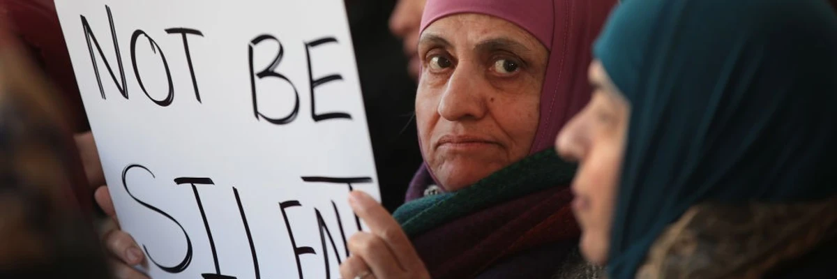 Demonstrators protest outside the office of Immigration and Customs Enforcement (ICE) on March 16, 2017 in Chicago, Illinois. The demonstrators were protesting the revised travel ban that the first administration of President Donald Trump was trying to implement. (Photo by Scott Olson/Getty Images)