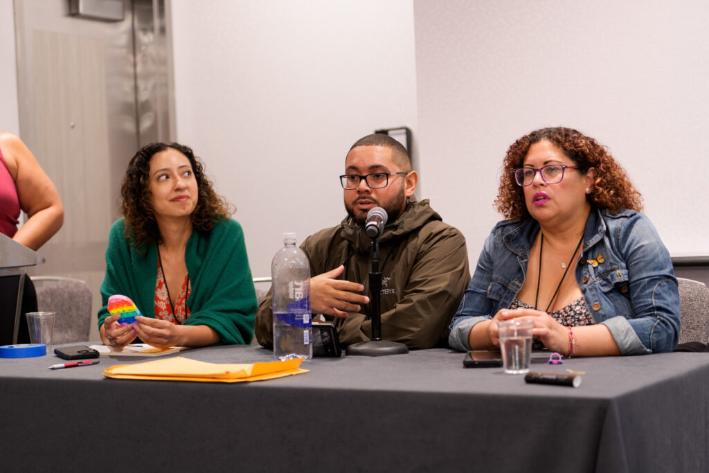 A group of people speaking on a panel