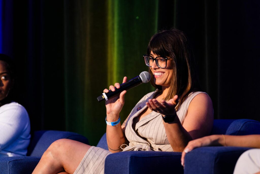A women with a microphone speaking
