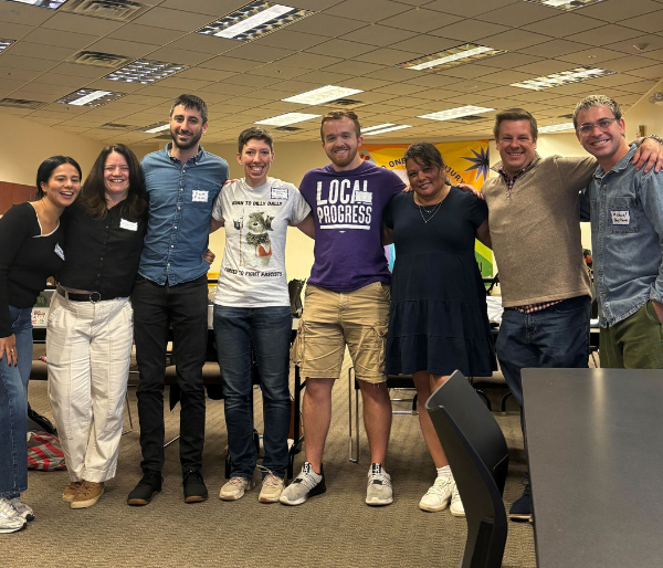 A group of people pose for a photo