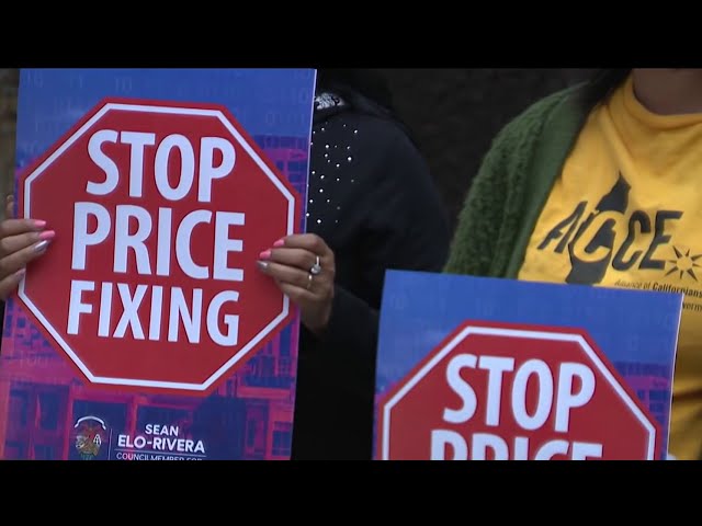 close up photo of people holding signs that read "STOP PRICE FIXING"