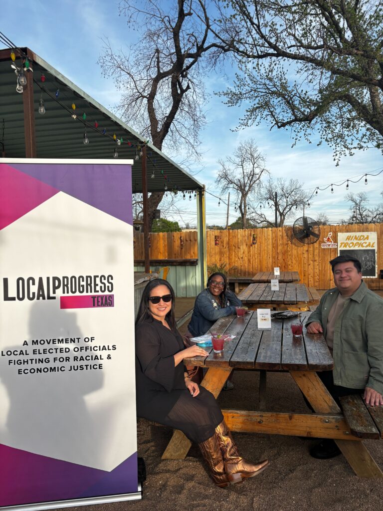 A picture of three people sitting at a table