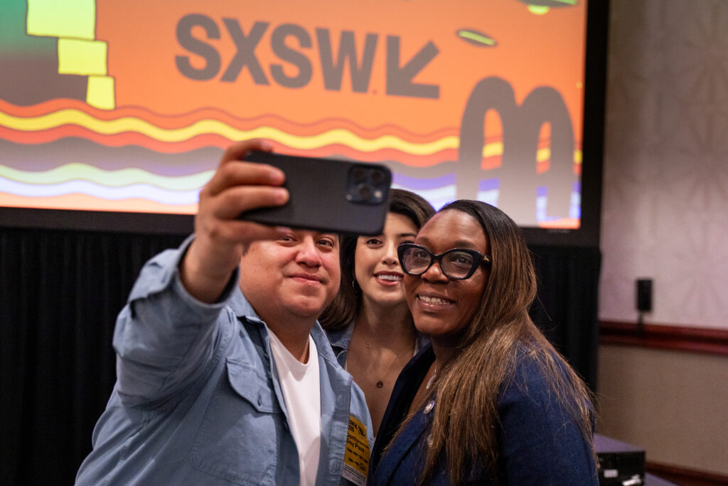 Three people taking a selfie together