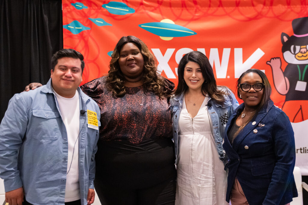 Four people posing for a picture