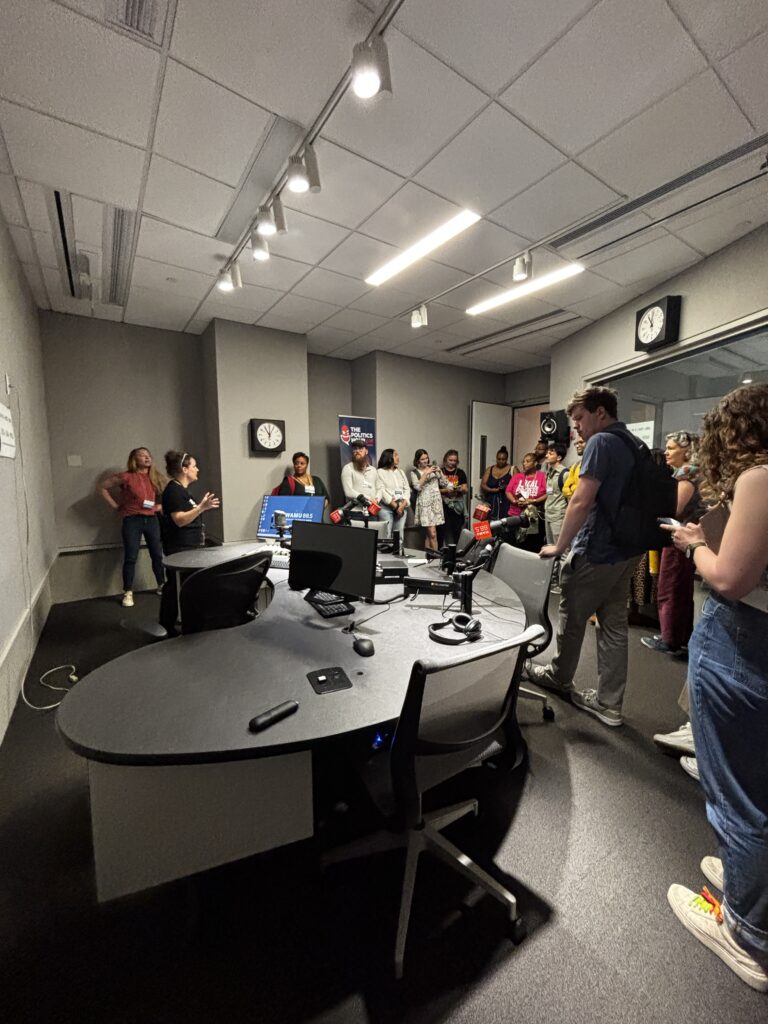 A large group of people exploring a radio station