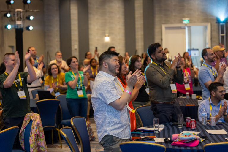 People standing and giving a standing ovation